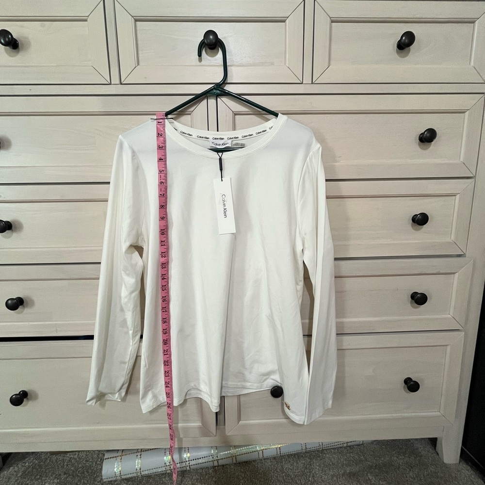 NWT women’s white long sleeve shirt.